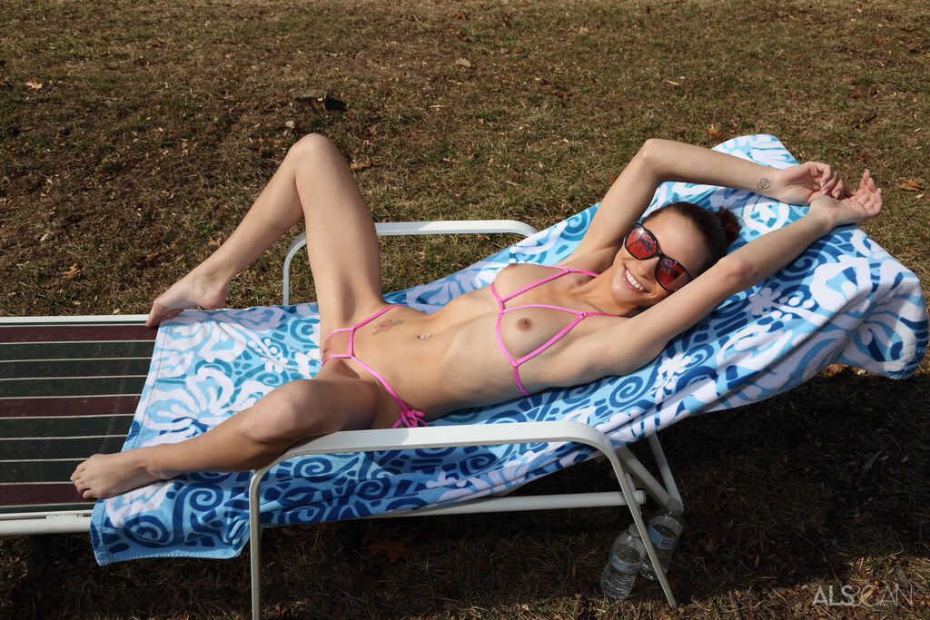 Slender teen Paisley Rae strokes her vagina on a lawn chair in the backyard while wearing a micro bikini - Paisley Rae