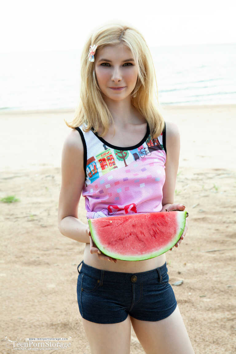 Blonde teen Aimee Cole removes white panties and socks before showing her twat on the beach. - Aimee Cole