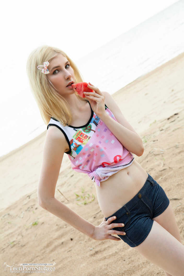 Blonde teen Aimee Cole removes white panties and socks before showing her twat on the beach. - Aimee Cole