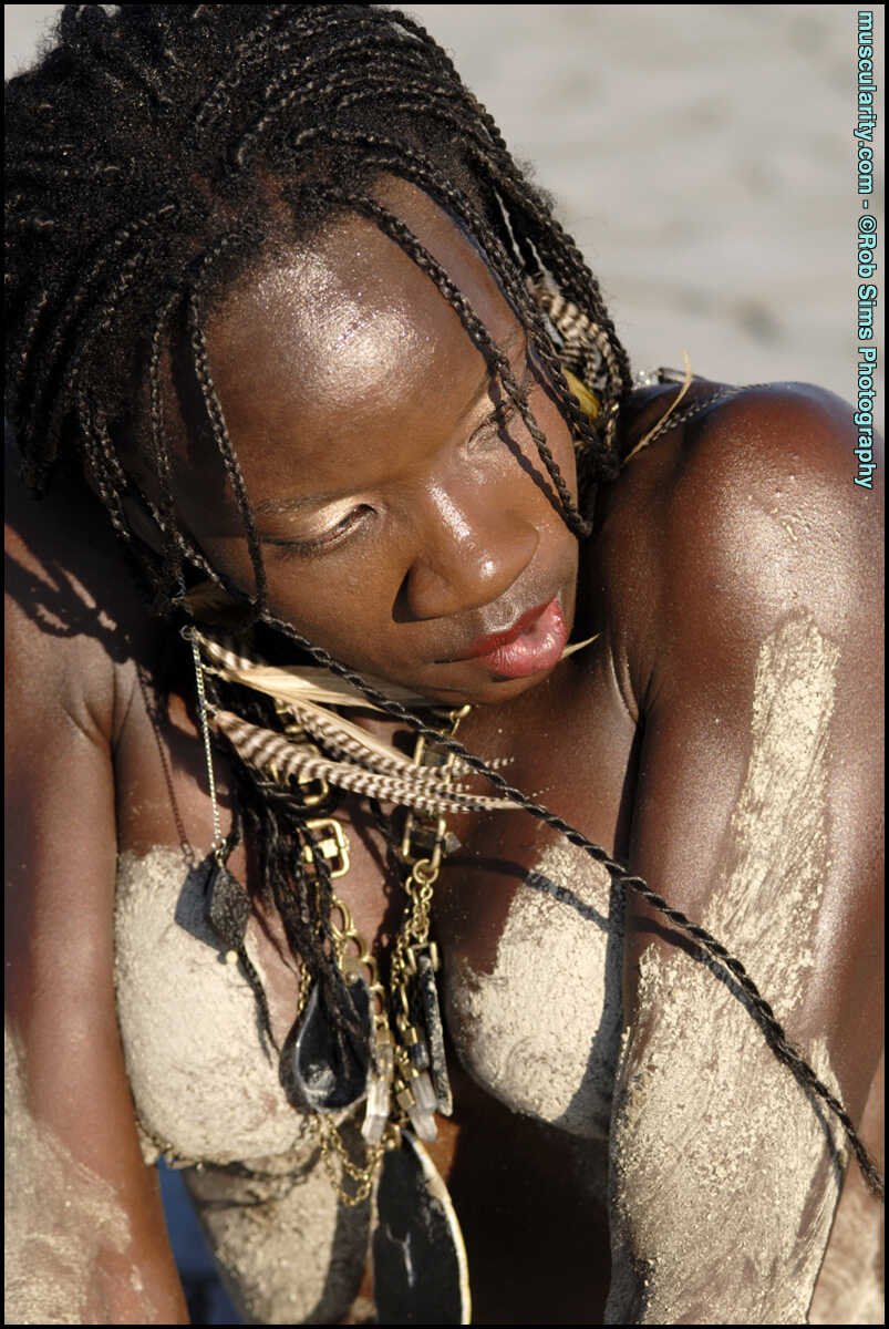 Ebony Bodybuilder Camille Elizabeth Covers Her Toned Body in the Sand with a Seductive Smile - Camille Elizabeth