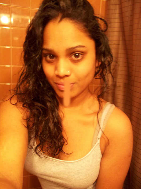 Pretty Indian girl takes bathroom selfies while getting undressed