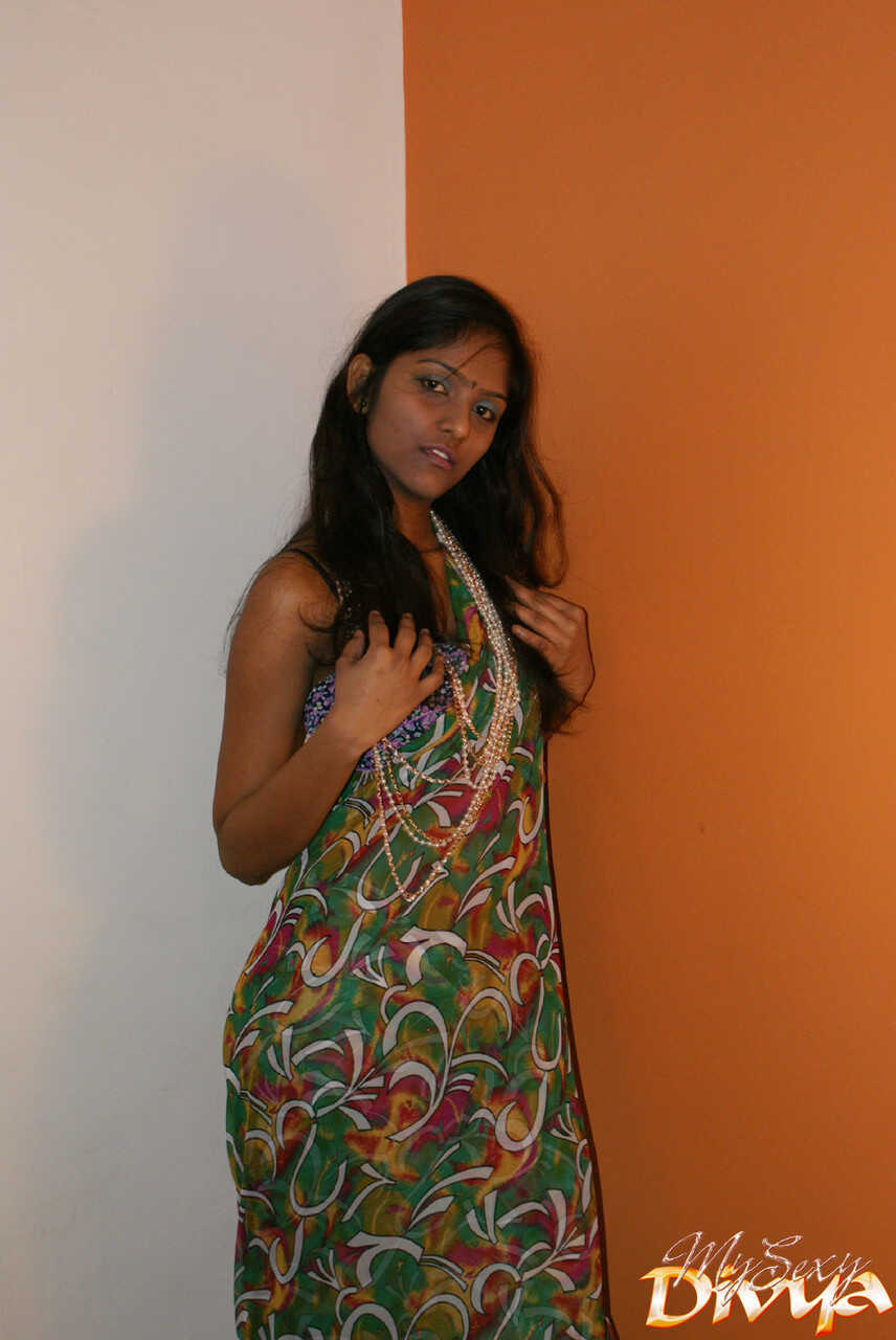 Slender Indian amateur Divya Yogesh exposes her natural small tits as she gets naked and plays with them in bed - Divya Yo...