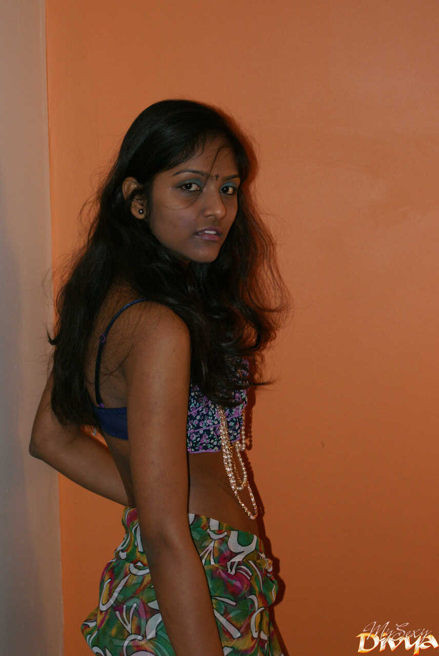 Slender Indian amateur Divya Yogesh exposes her natural small tits as she gets naked and plays with them in bed - Divya Yo...