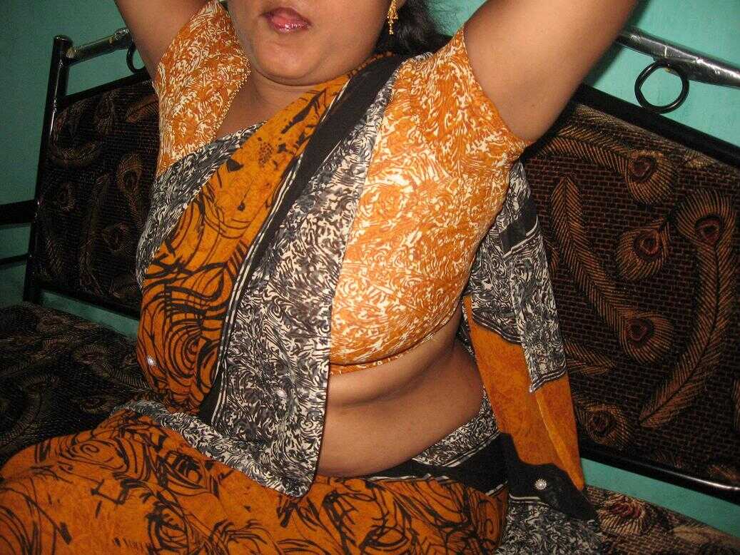 Tongue-tied MILF with full Indian boobs .