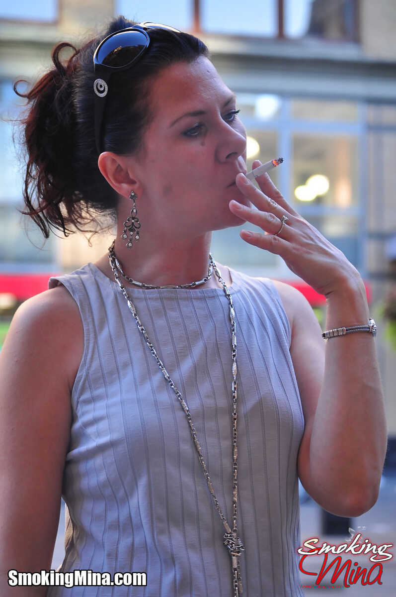 Businesswoman Pulls Out Her Cigarette On The Streets Of New York City While Fully Clothed