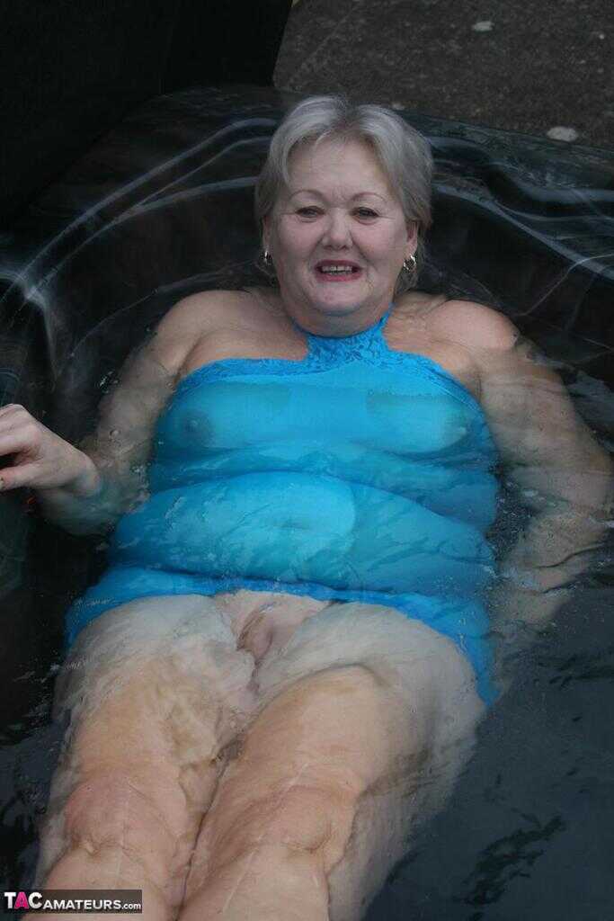 Granny's Big Tits and Wet Twat Exposed in the Hot Tub