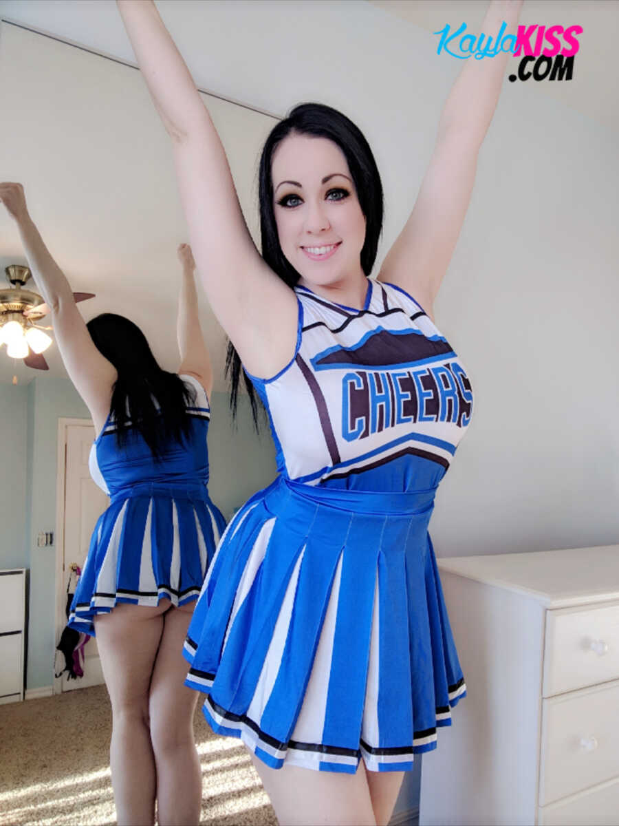 Dark-haired cheerleader Kayla Kiss uncovers her big natural tits in OTK socks while spreading her legs for you - Kayla Kiss