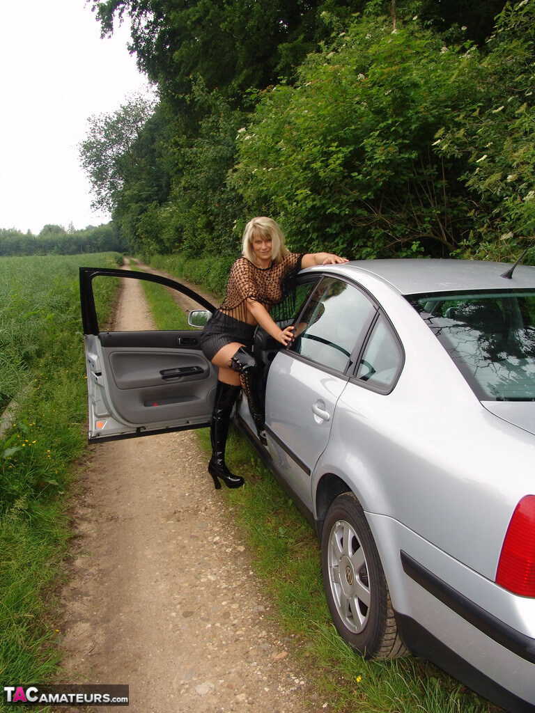 Mature Woman Sweet Susi Exposes Herself in the Country Lanes Wearing OTK Boots and Sharing Her Big Ass MILF with Car Passe...