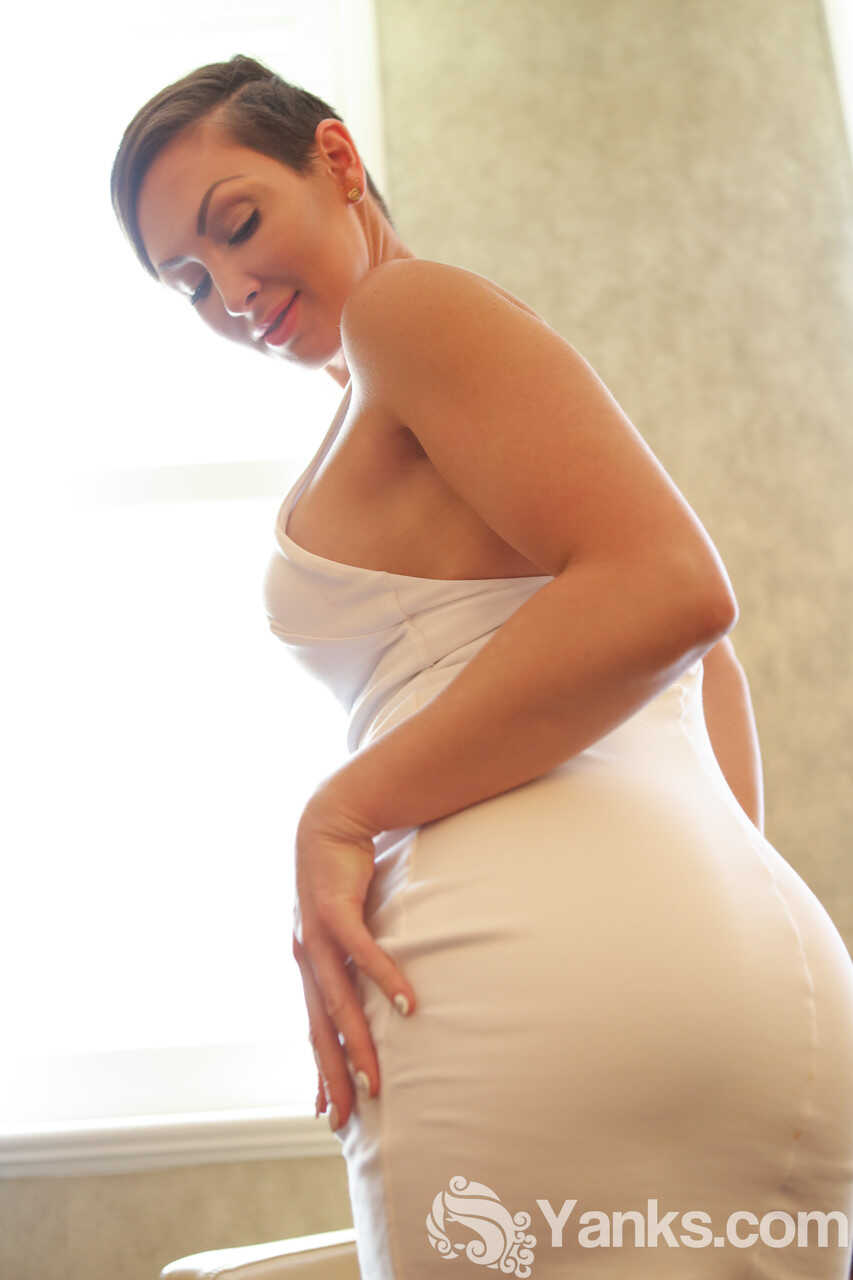 Curvaceous amateur Yasmin Scott bends over in her short hair to show off her big ass while stroking her naked pussy after ...
