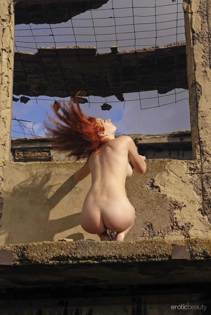 Natural redhead Elis B poses for a daring nude shoot in an derelict building - Elis B