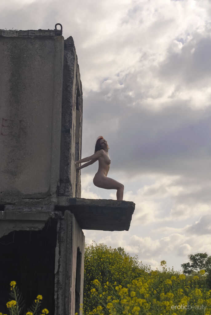 Natural redhead Elis B poses for a daring nude shoot in an derelict building - Elis B