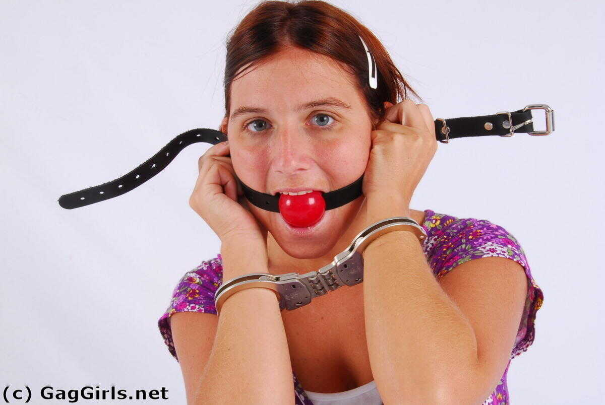 Redhanded Redhead: Fitting Herself With A Ball Gag While Wearing Handcuffs - 