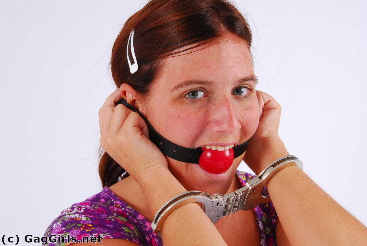 Redhanded Redhead: Fitting Herself With A Ball Gag While Wearing Handcuffs - 