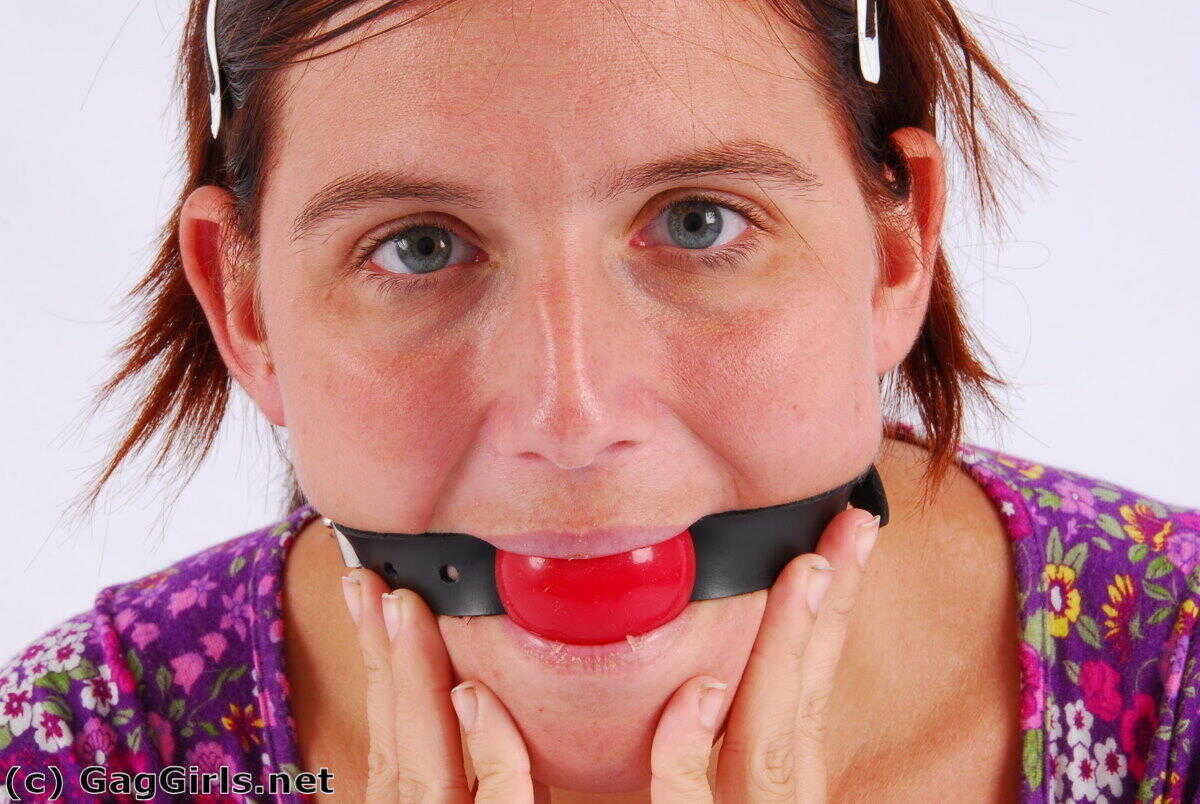 Redhanded Redhead: Fitting Herself With A Ball Gag While Wearing Handcuffs - 