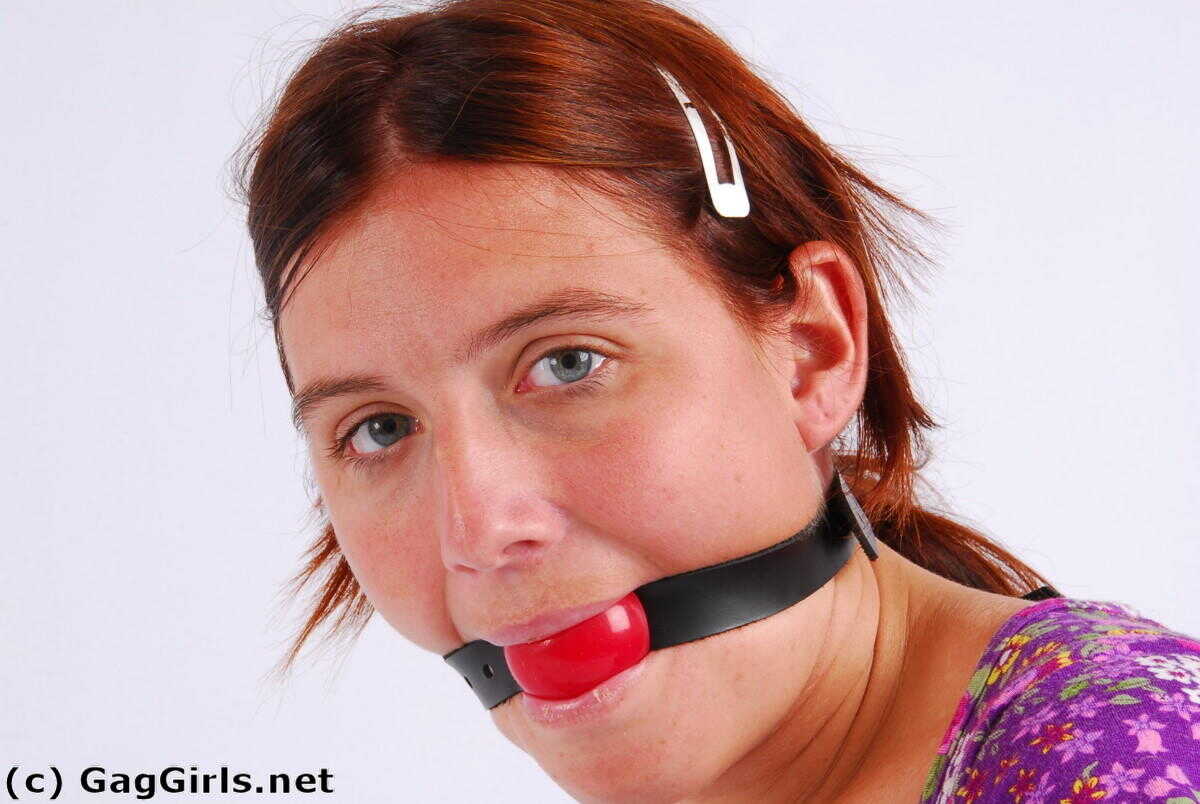 Redhanded Redhead: Fitting Herself With A Ball Gag While Wearing Handcuffs - 