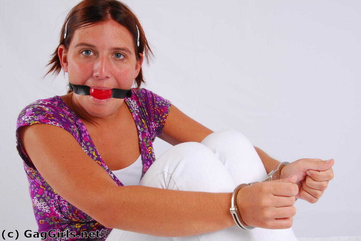 Redhanded Redhead: Fitting Herself With A Ball Gag While Wearing Handcuffs - 