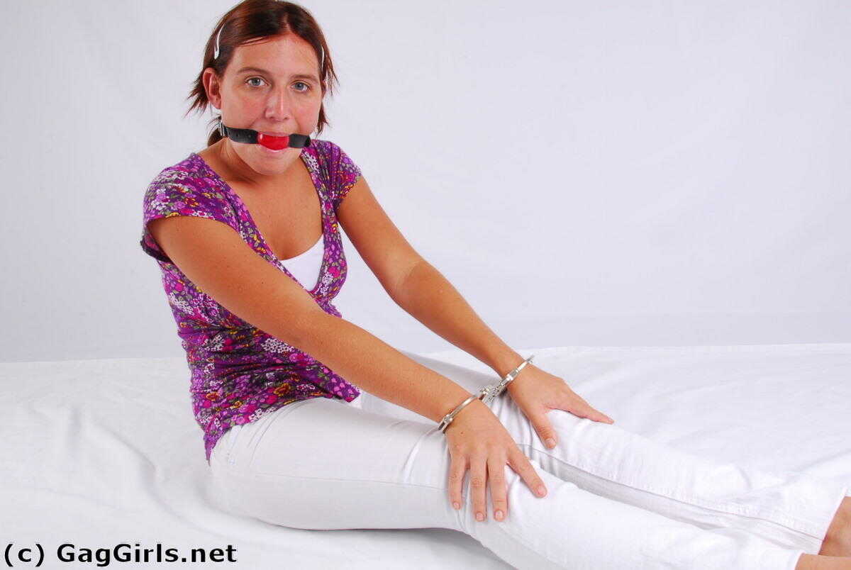 Redhanded Redhead: Fitting Herself With A Ball Gag While Wearing Handcuffs - 