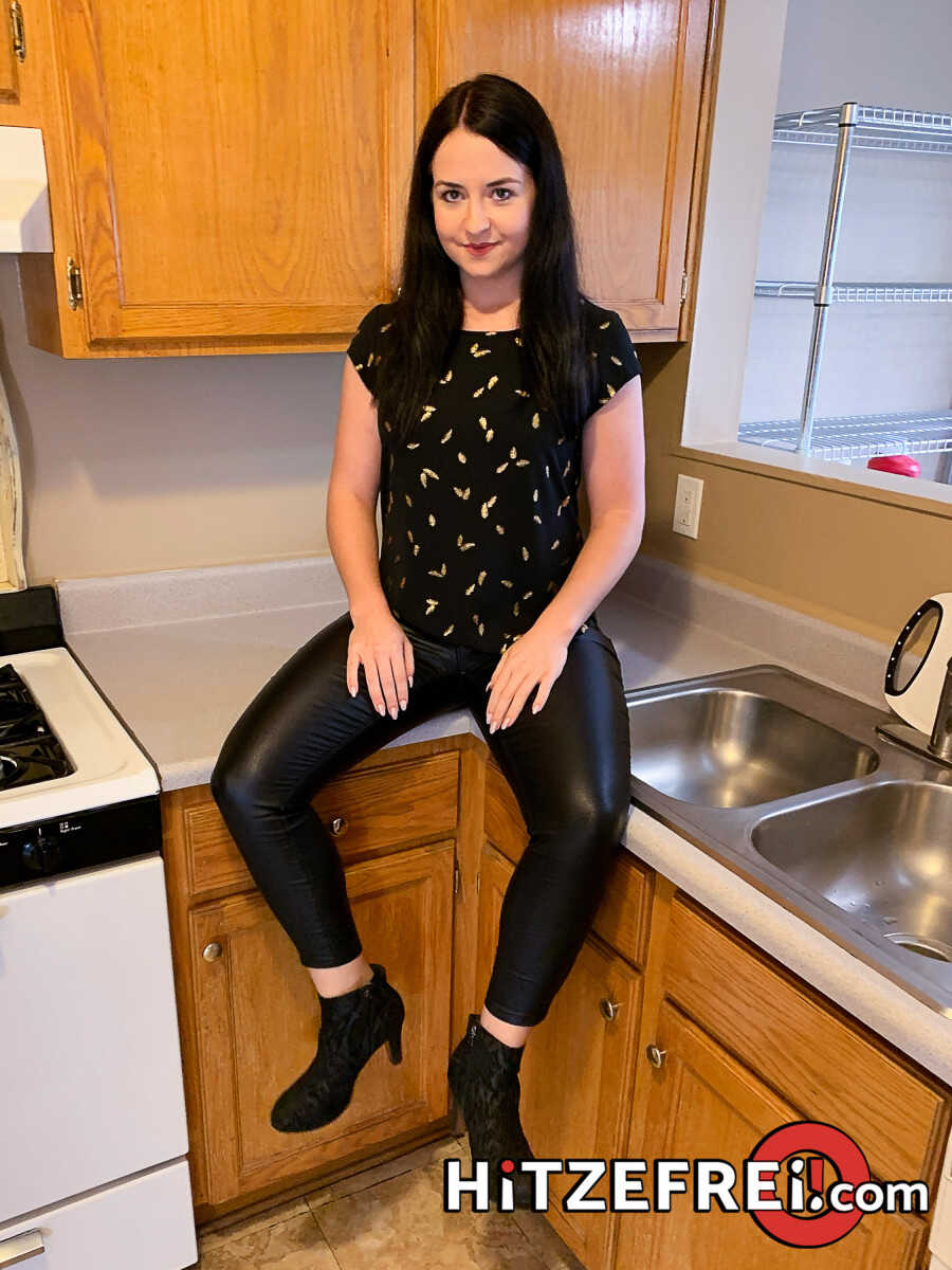 Emma Secret’s Dark Hair Swings as She Takes on Two Strangers in a Kitchen Fuck