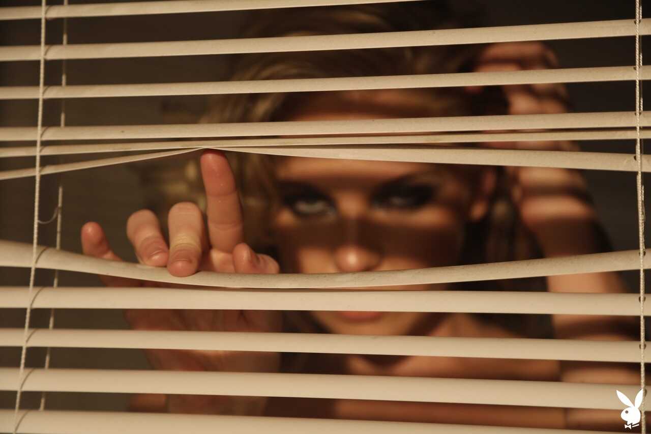 Hot blonde Kayslee Collins shows off her sexy legs in high heels while spying through the blinds.