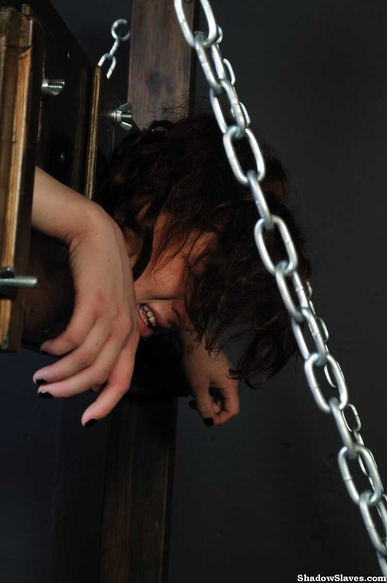 Redheaded Slave Girl Isabel Dean is Blindfolded and Locked in Stocks for her Naughty Curves - Isabel Dean