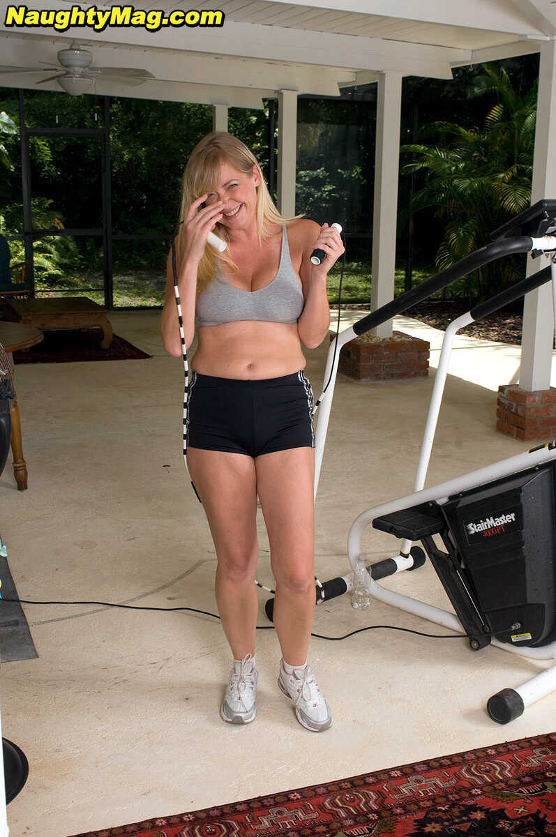 Busty blonde MILF Casey Bryant exposes her big natural tits while working out at the gym with a dildo - Casey Bryant