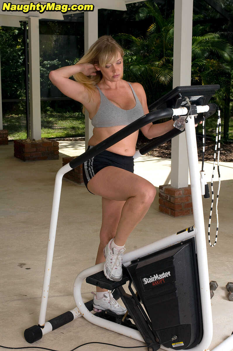 Busty blonde MILF Casey Bryant exposes her big natural tits while working out at the gym with a dildo - Casey Bryant