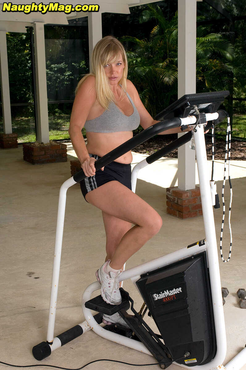 Busty blonde MILF Casey Bryant exposes her big natural tits while working out at the gym with a dildo - Casey Bryant