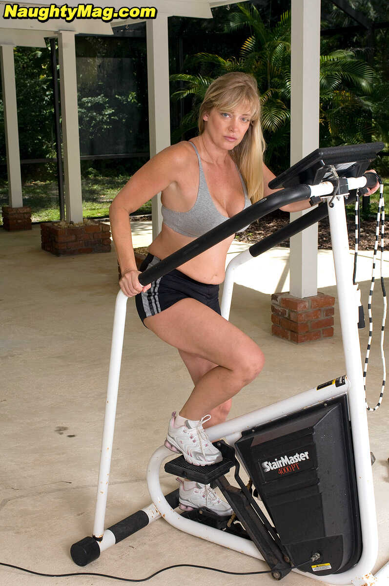 Busty blonde MILF Casey Bryant exposes her big natural tits while working out at the gym with a dildo - Casey Bryant