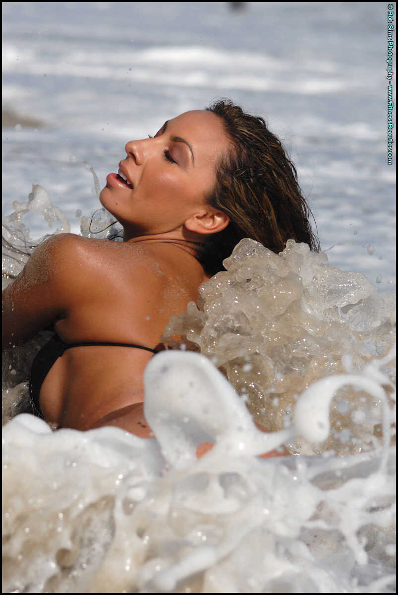 Latina MILF Vanessa Cervantes takes off her bikini top in a tempting fashion while on the beach, showing off her curvy bod...