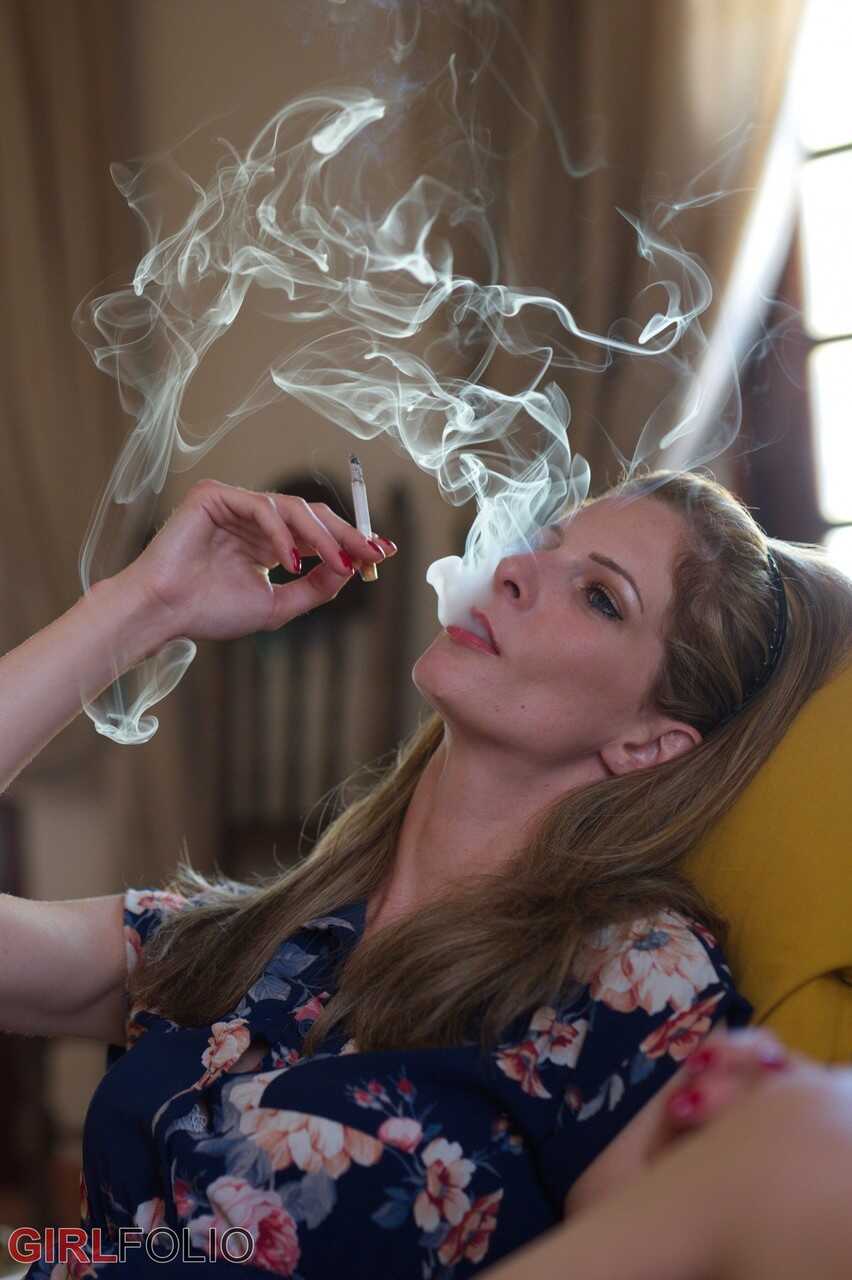 Sexy Rebecca Leah teases with her upskirt panties while smoking in public! - Rebecca Leah