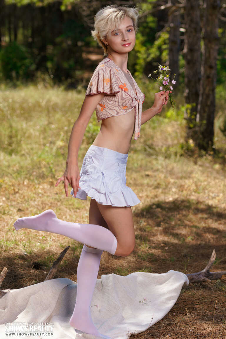 Young solo girl with short blonde hair strips to her knee socks in a clearing   Forest Adventure with the Blonde Knee Sock Stripper