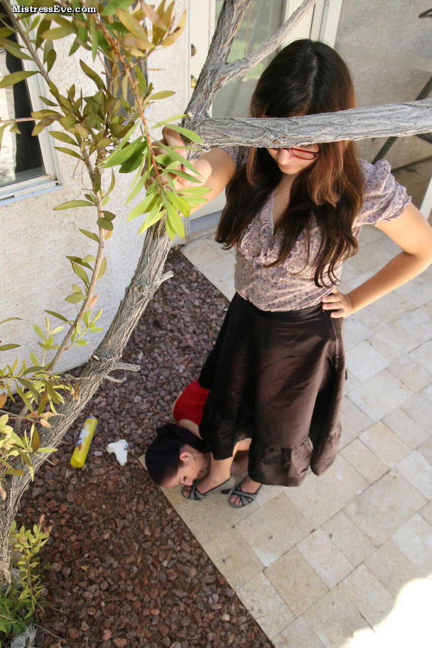 Brunette chick goes down on her lesbian lover's soapy feet on a sunny patio - 