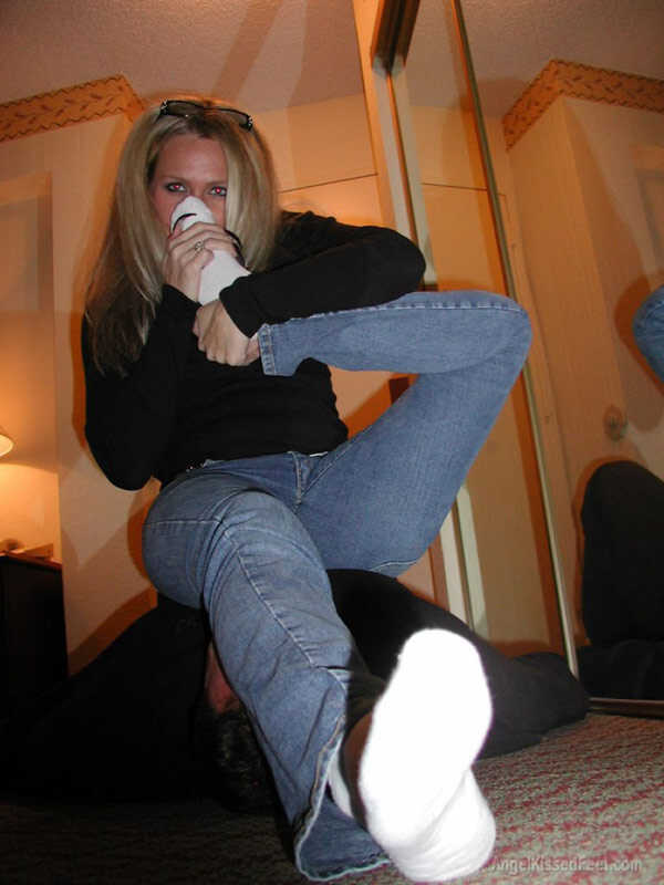 A Dominating Blonde Goddess Takes Off Her Socks While Having Her Mature Feet Worshiped and Smothered with Jeans - 