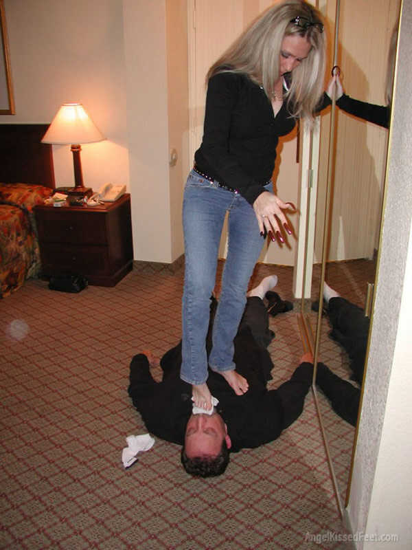 A Dominating Blonde Goddess Takes Off Her Socks While Having Her Mature Feet Worshiped and Smothered with Jeans - 
