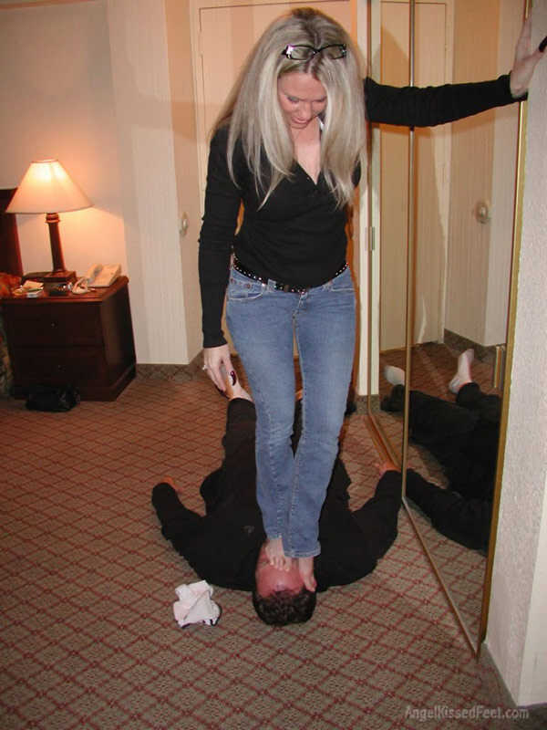 A Dominating Blonde Goddess Takes Off Her Socks While Having Her Mature Feet Worshiped and Smothered with Jeans - 