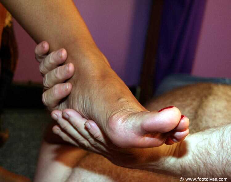 Caucasian female rubs her feet all over an old man's face - 