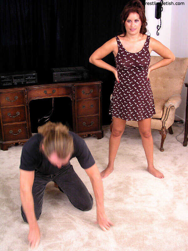 Dominatrix with Muscular Thighs Grinds on Her Submissive's Crotch While Wearing High Heels . - 