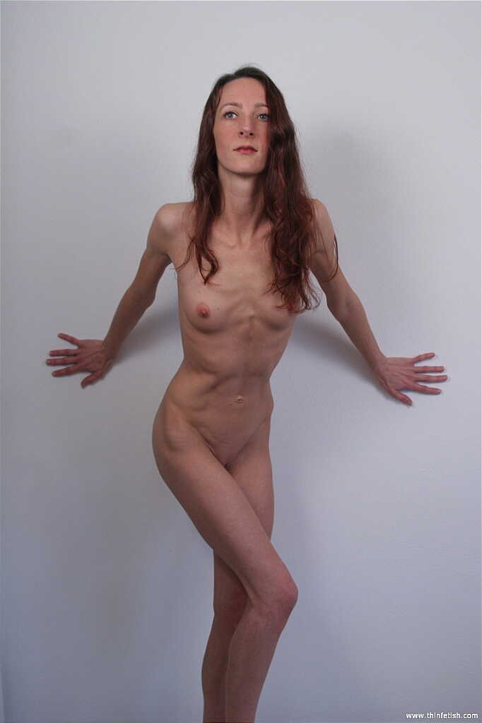Skinny MILF Heather slowly strips naked in fetish lingerie for a bare naked modeling session - Heather
