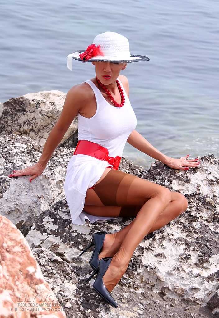 Classy Lily Wow Reveals Her Vintage Pussy on a Seaside Cliff in Tan Nylons - Lily Wow
