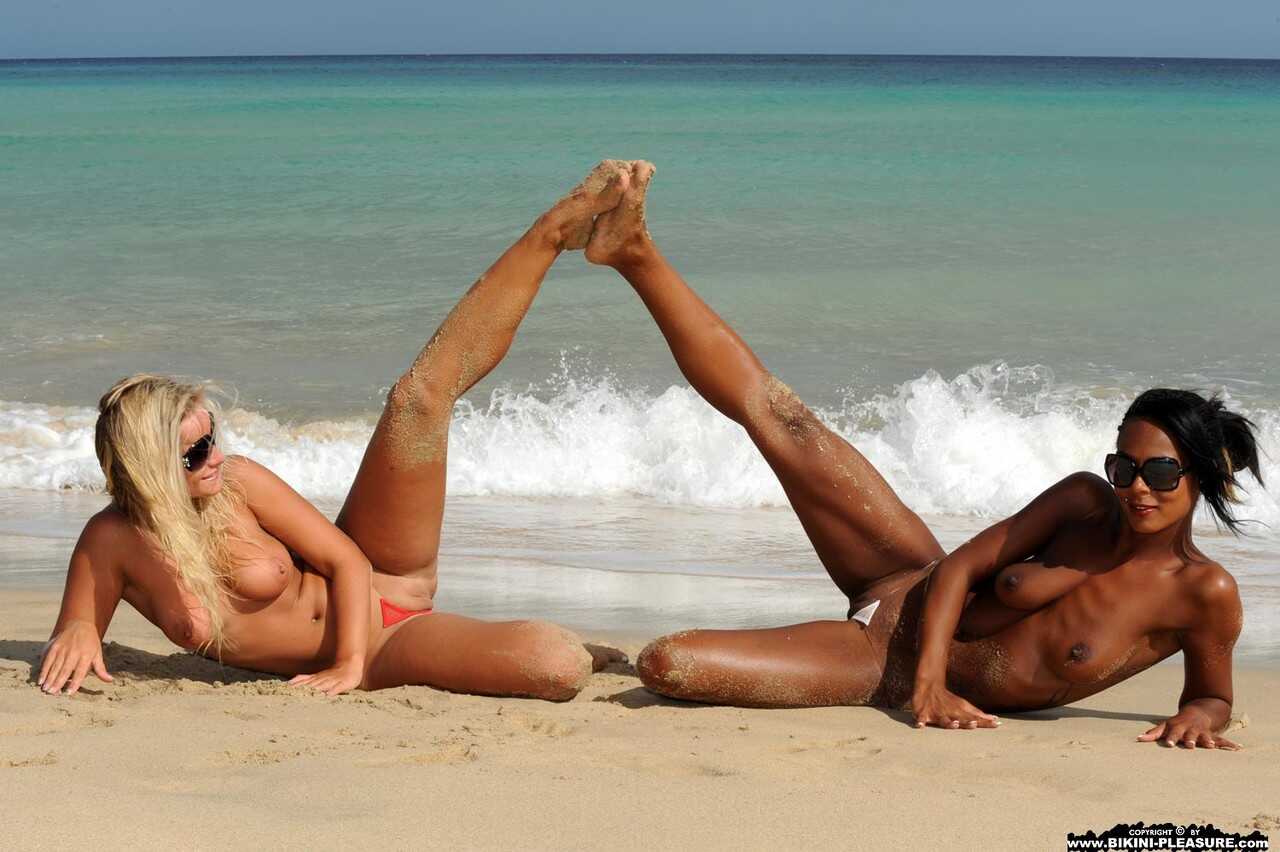Marry Queen and her lesbian lover go topless on a beach in bikini bottoms, while Muslim Nudist Queen Isabella Chrystin exp...