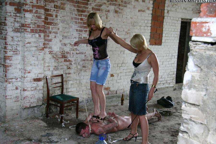 Buxom Blonde Country Girls Cruelly Trample and Smack Their Naked Servant's Face While He's on His Knees