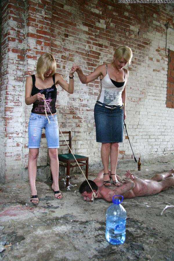 Buxom Blonde Country Girls Cruelly Trample and Smack Their Naked Servant's Face While He's on His Knees - 