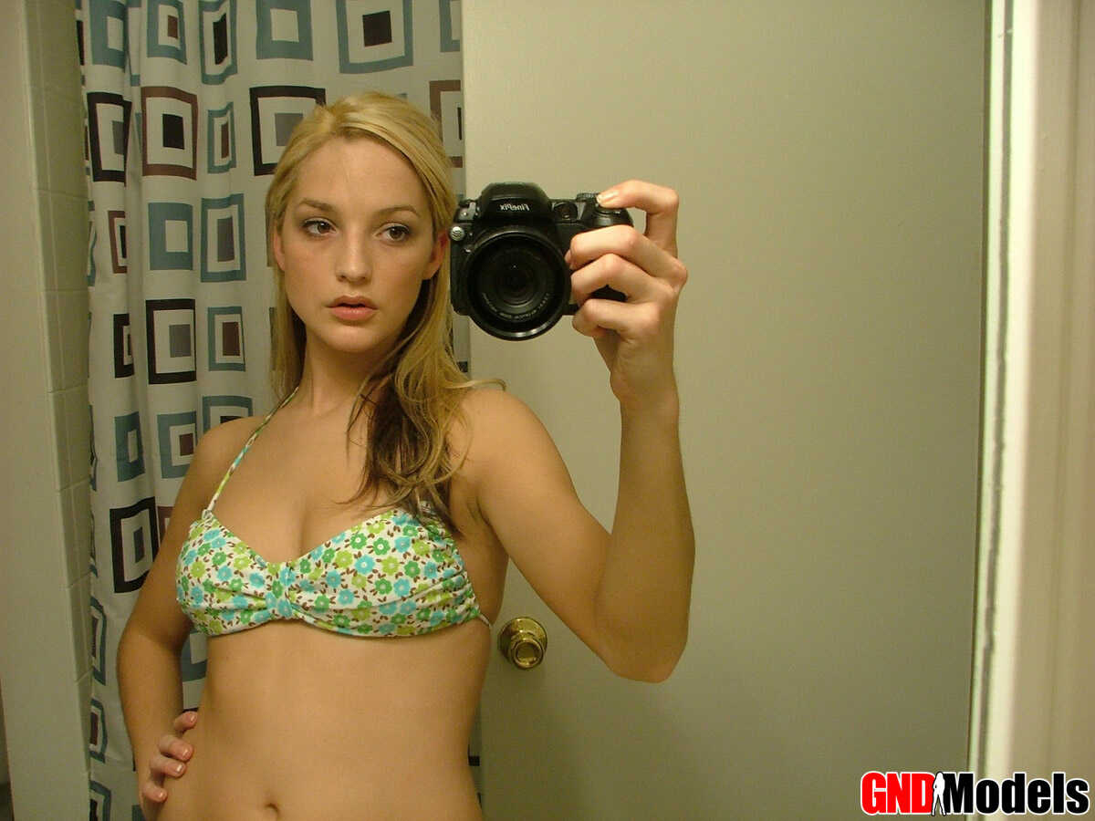 Blonde teen Marilyn takes mirror selfies while wearing a three-piece swimsuit, and it's the hottest thing you'll...