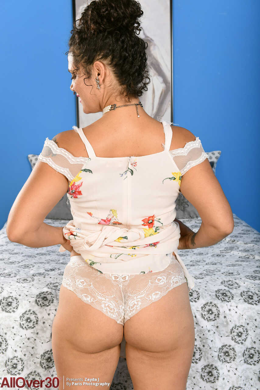 Over 30 housewife Zayda J wears her hair up for a nude solo shoot with her big tits and hairy pussy on display - Zayda J