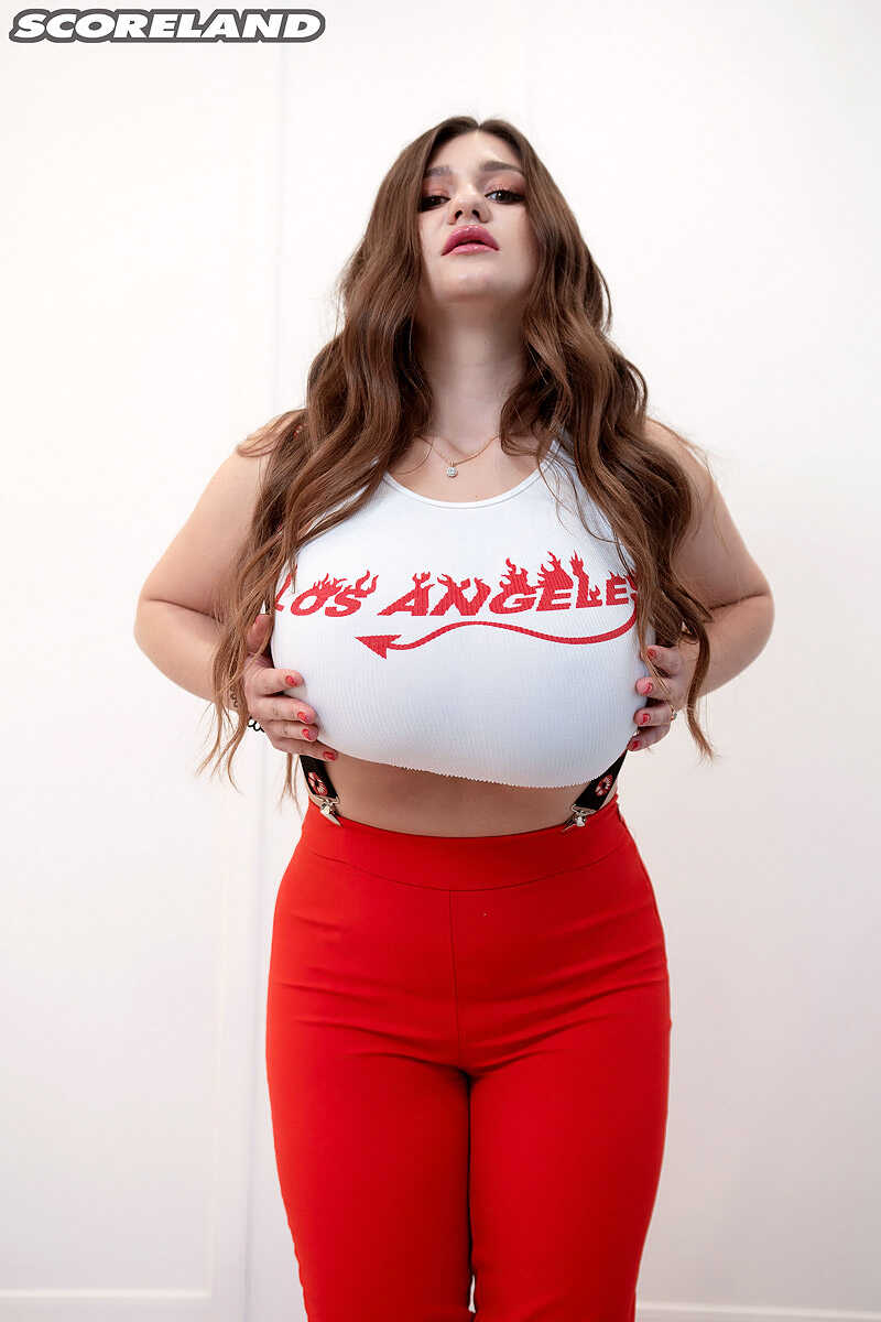 Solo model Demmy Blaze releases her massive boobs from a cropped top Bent Over Tits - Demmy Blaze