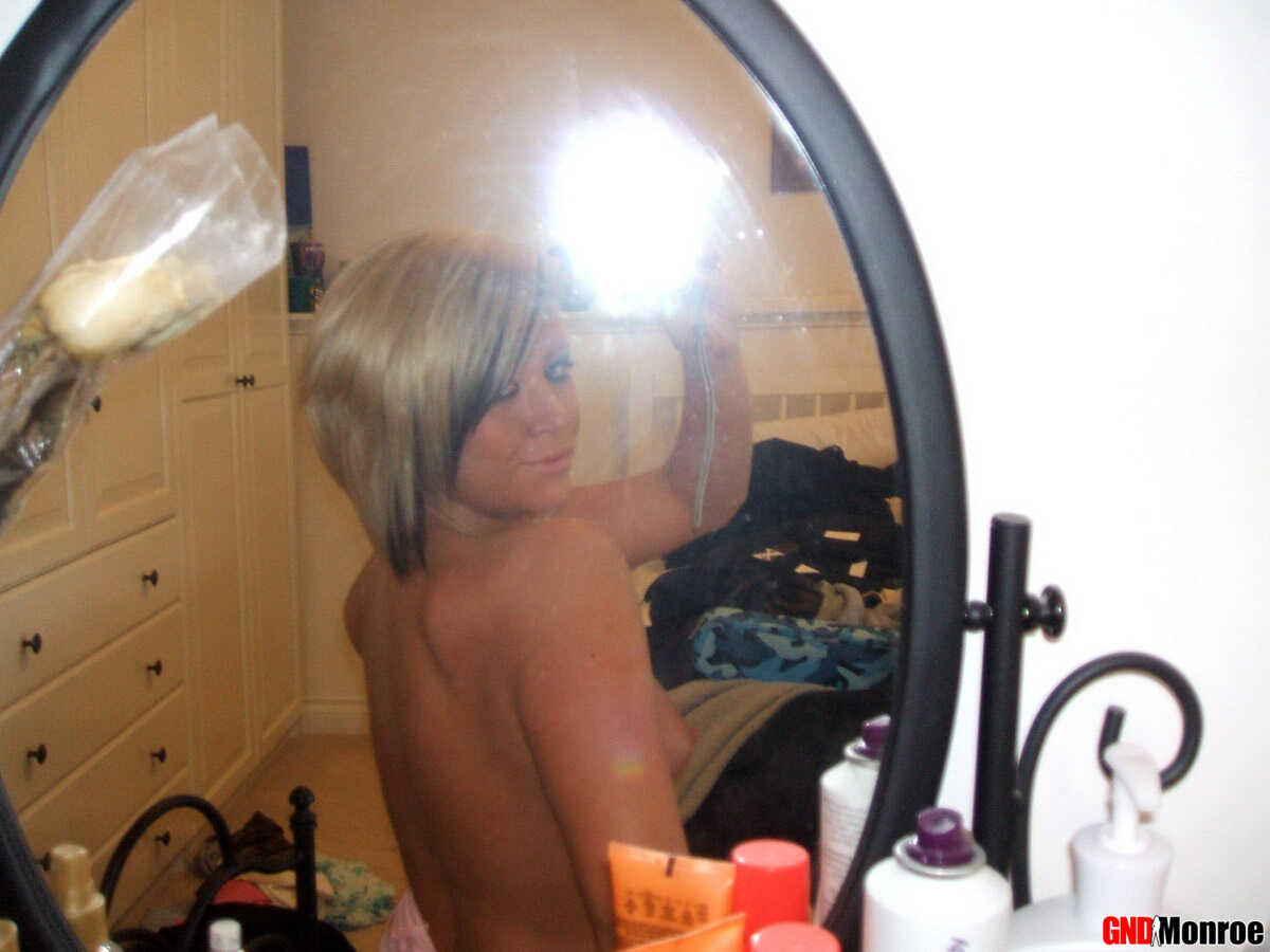 Blonde Bombshell Takes Self-Shots in the Buff: A Naughty Temptress Strips Down to Tease