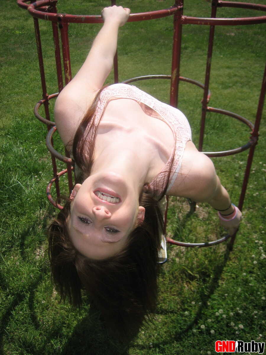 Natural redhead flashes her tits on playground equipment in a field while getting fucked by a stranger in an outdoor public area 