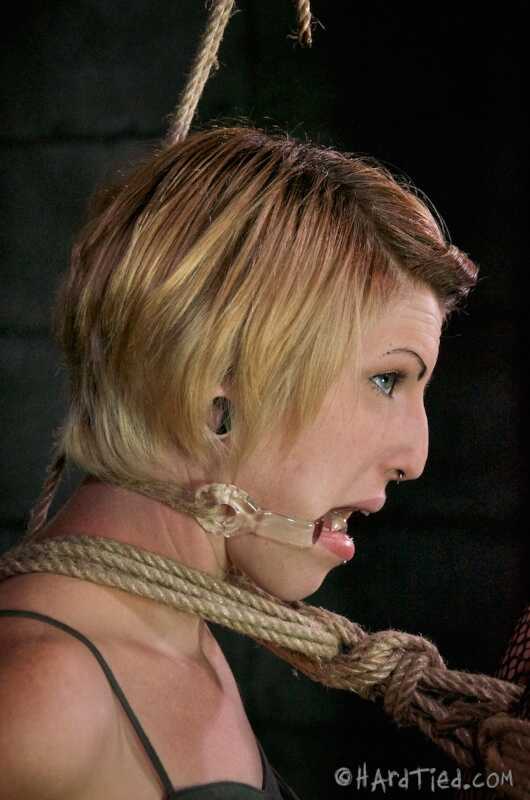 Kay Kardia's Short Hair Is Restrained With Ropes In A Dungeon As She Poses For The Camera While Wearing Pantyhose And...