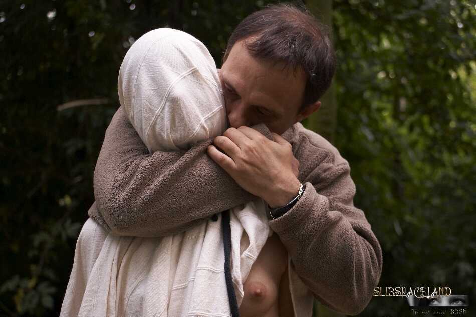 Young Cayenne blonde teen suspended upside down in the woods gets her hair pulled by a dominant nudist. - Cayenne Klein
