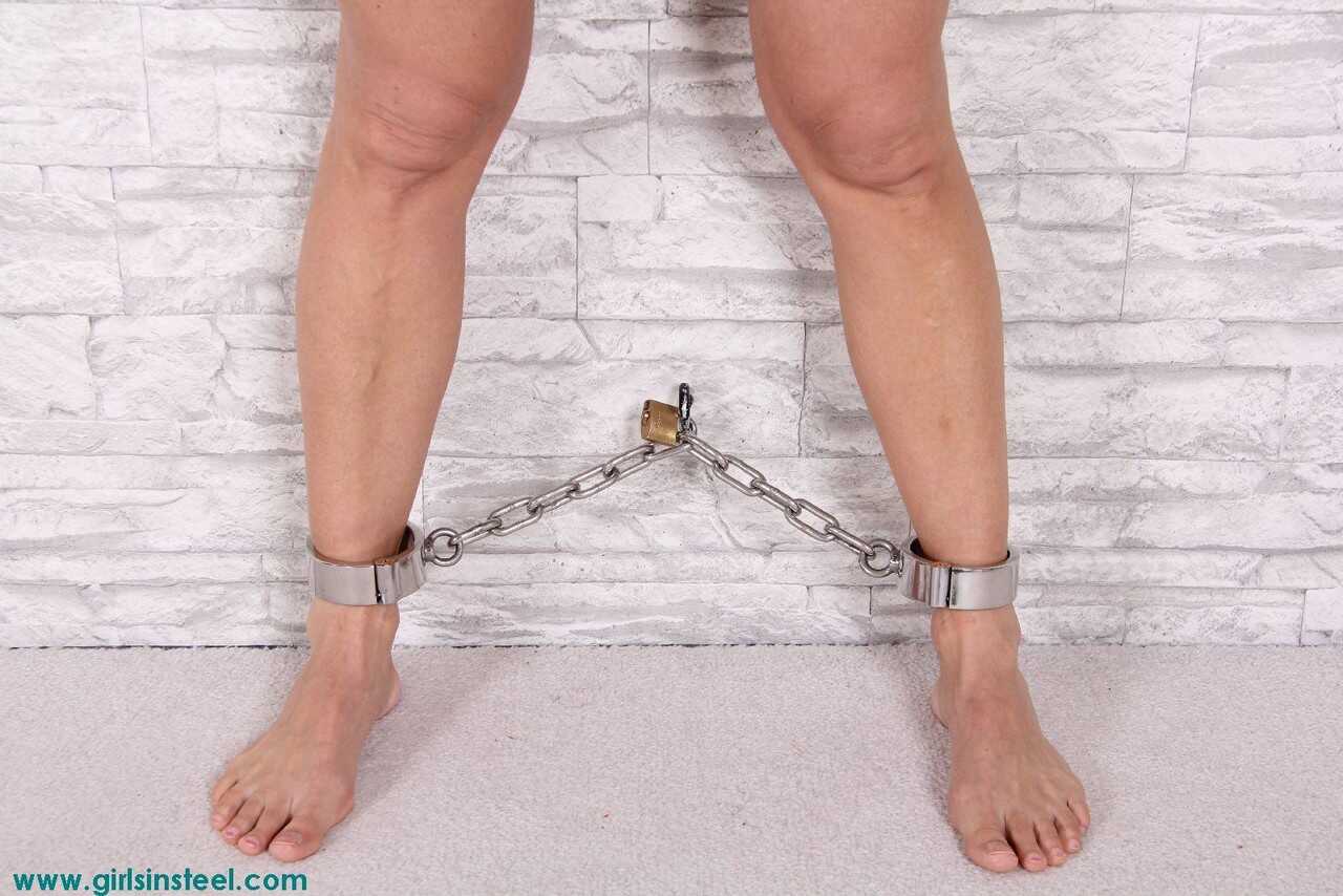 Chained and Cuffed: The Busty White Goddess